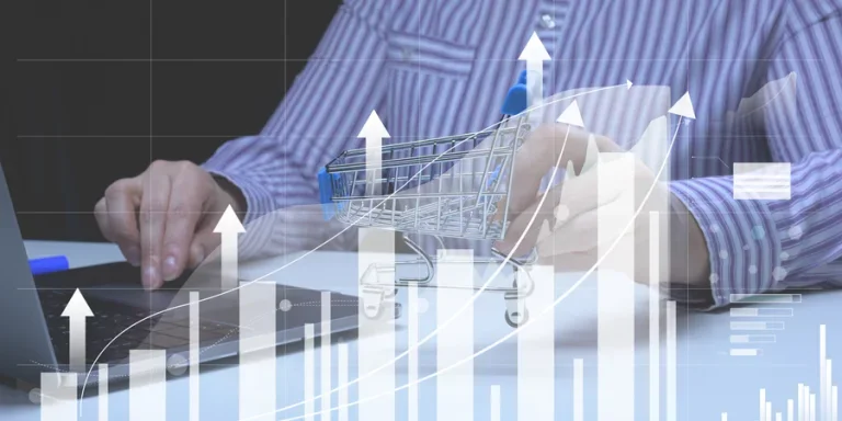 Woman sits at a laptop in front of a holographic chart with growing indicators