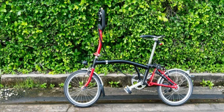 a black and red folding bike