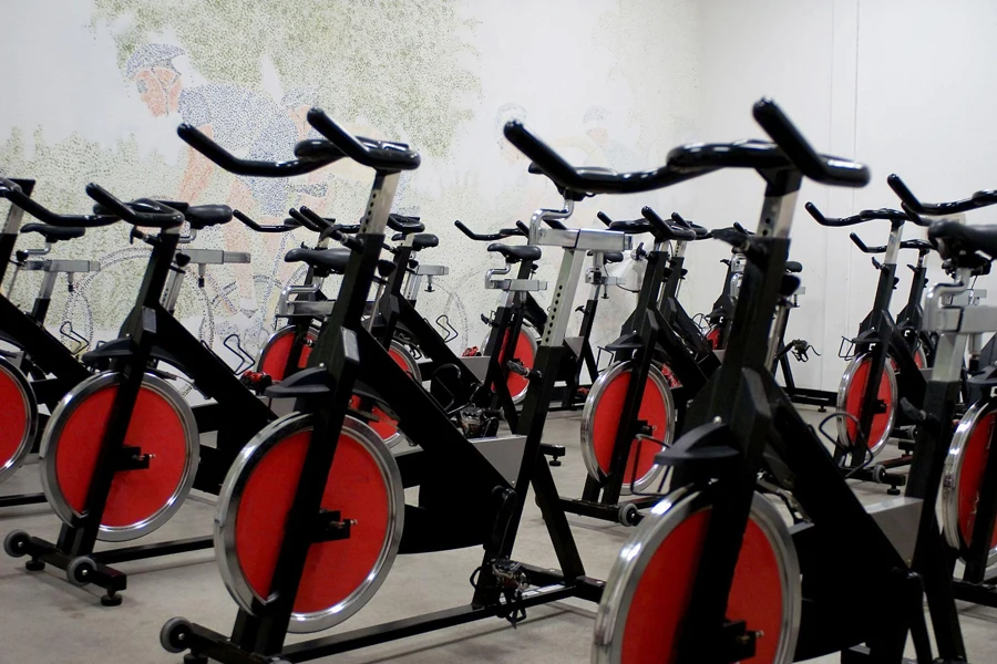 a group of spinning bikes