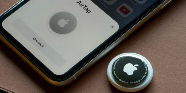 An AirTag being connected to an iPhone