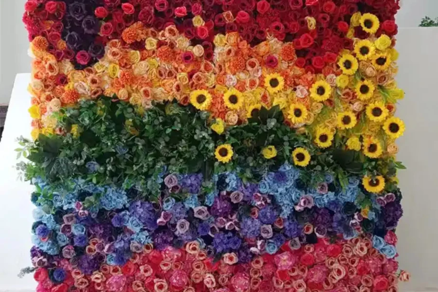 Eine 3D-Blumenwand mit Ombre-Regenbogen