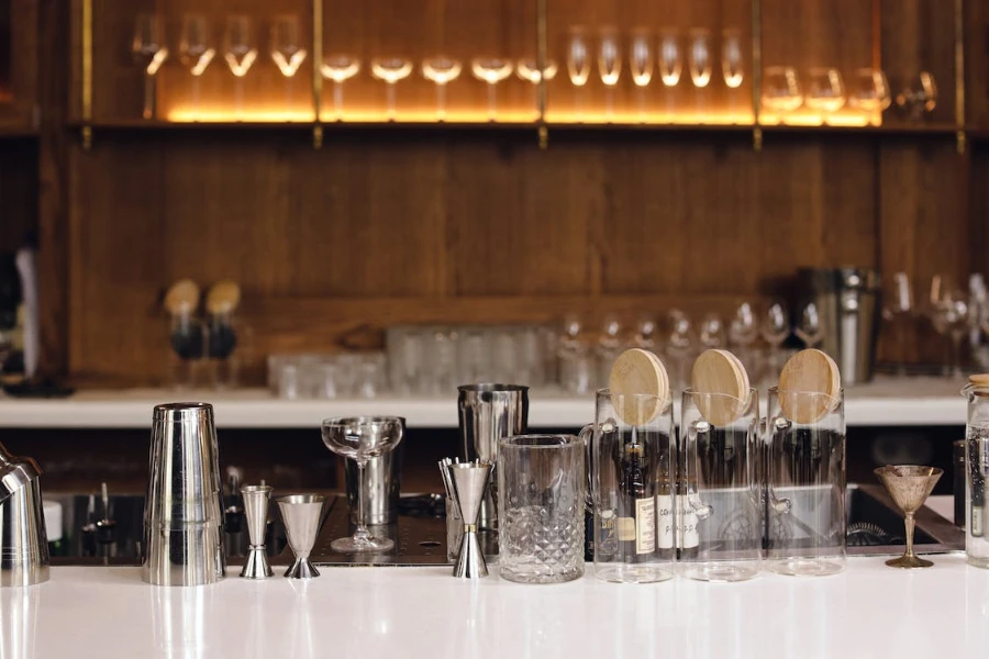 Assortment of bar tools on a white bar top