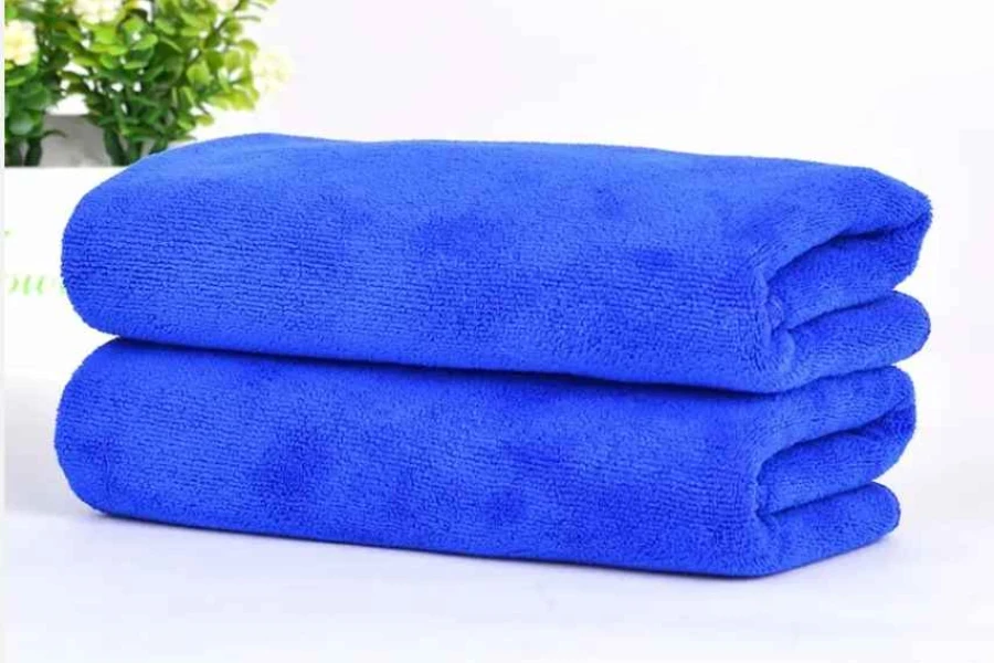 Blue washing towels on a white background