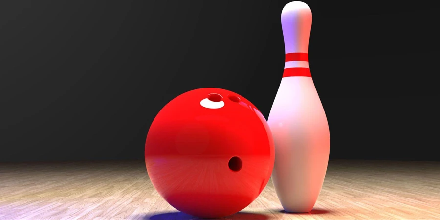 Bowlingkegel mit einer roten Kugel