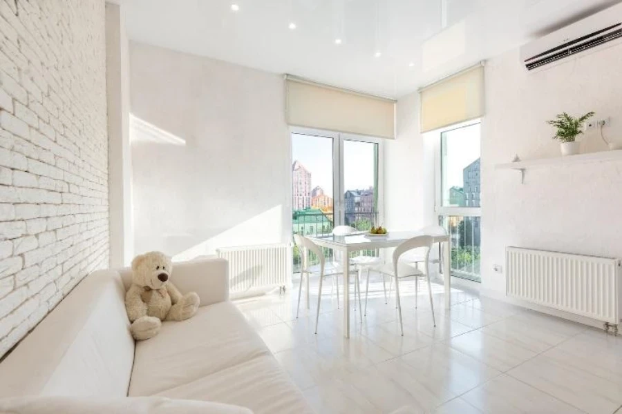 Contemporary apartment room with roller shades