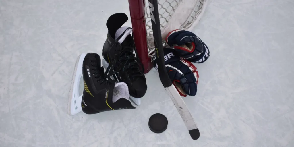 Ice hockey training equipment sitting against hockey net