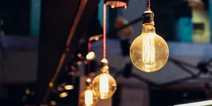 Illuminated light bulbs hanging in a line
