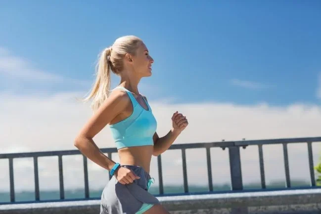 A jogger wearing a heart rate watch / Credit: Ground Picture via Shutterstock