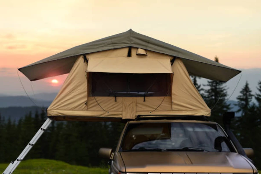 Inflatable rooftop tent with additional space and ladder