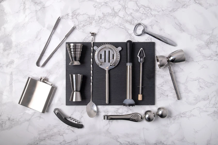 Overhead shot of various bar tools on a marble surface