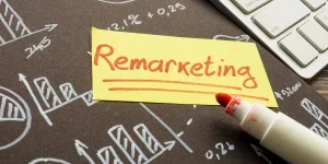Remarketing written on a sticker with graphs behind it