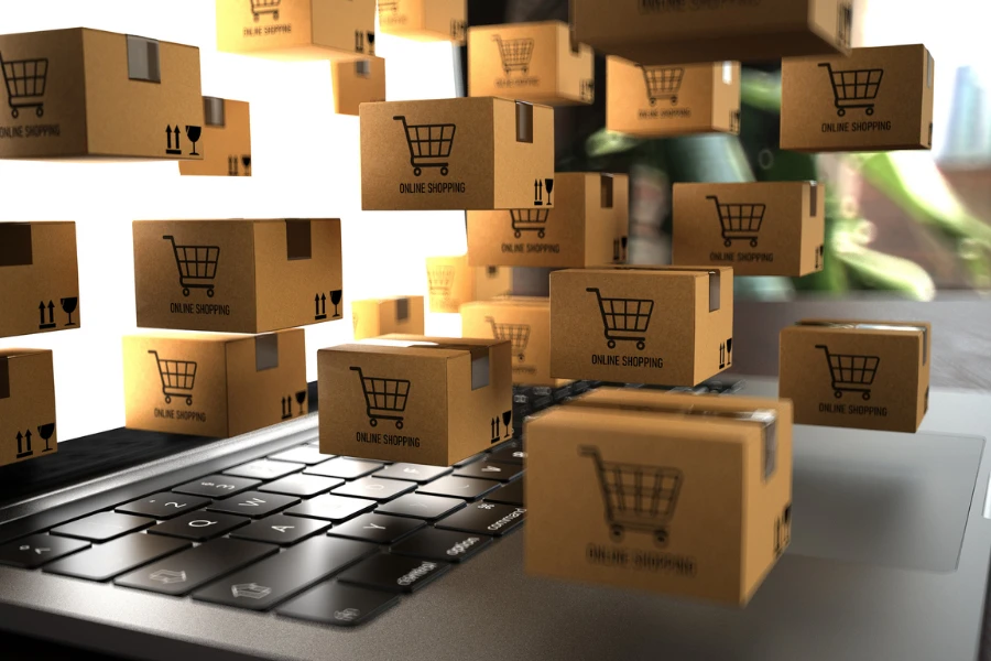 Small shipping packages hovering above a laptop