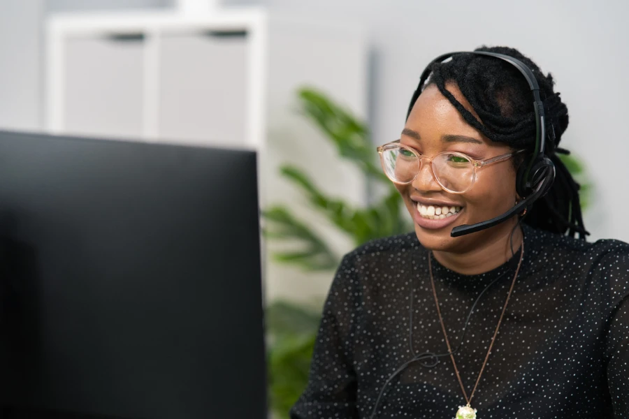 Smiling customer service agent wearing headset