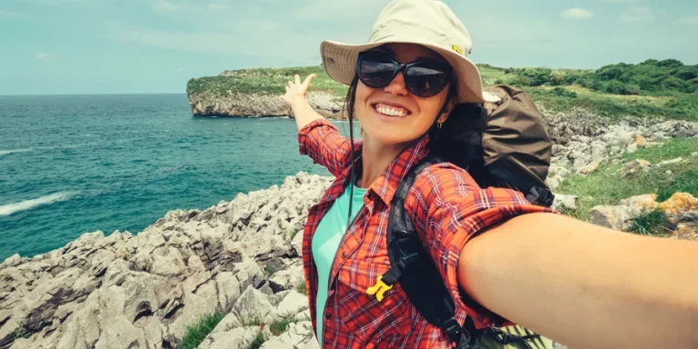 taking selfies beside the ocean shore