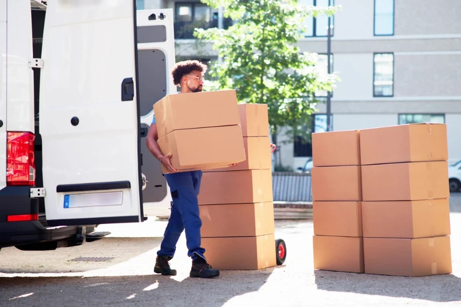 Unloading cardboard boxes from a van