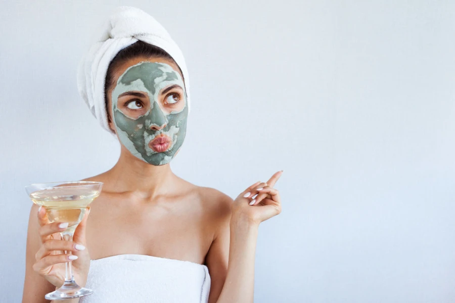 Woman striking a funny pose while wearing a facial mask