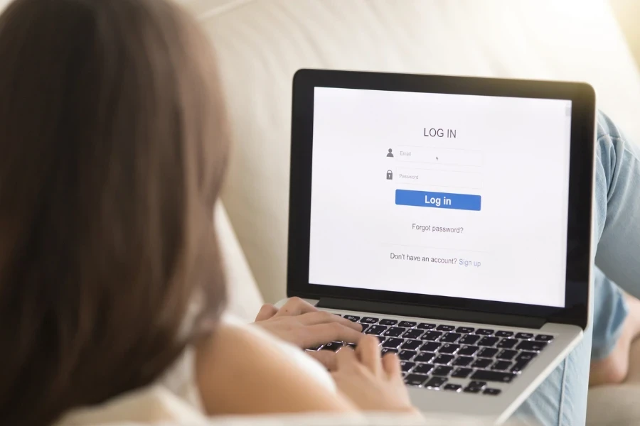 Woman using her laptop in a log in page