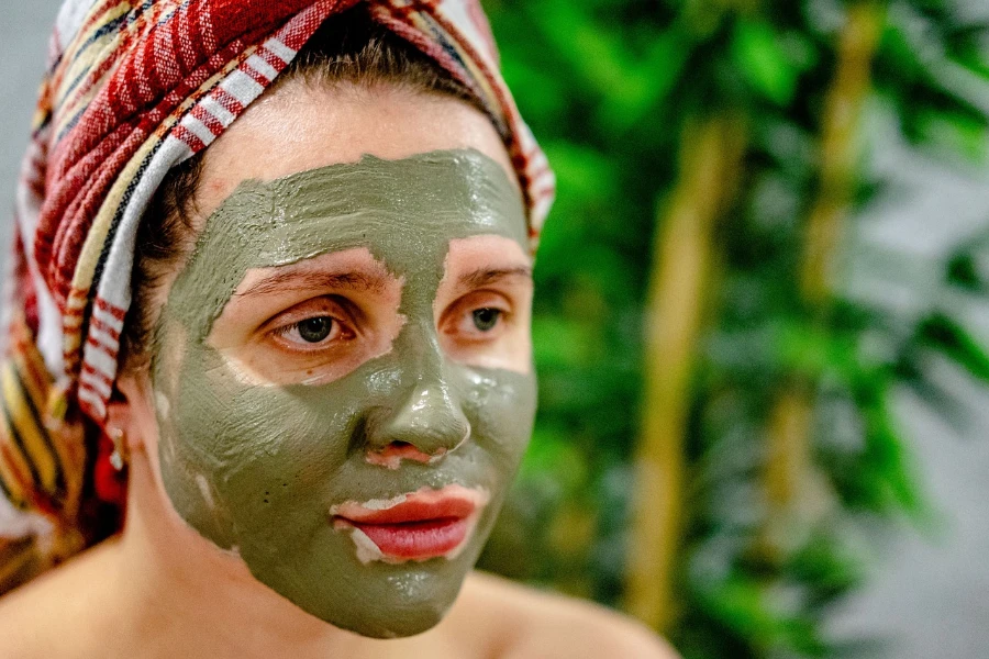 Woman wearing a green facial mask
