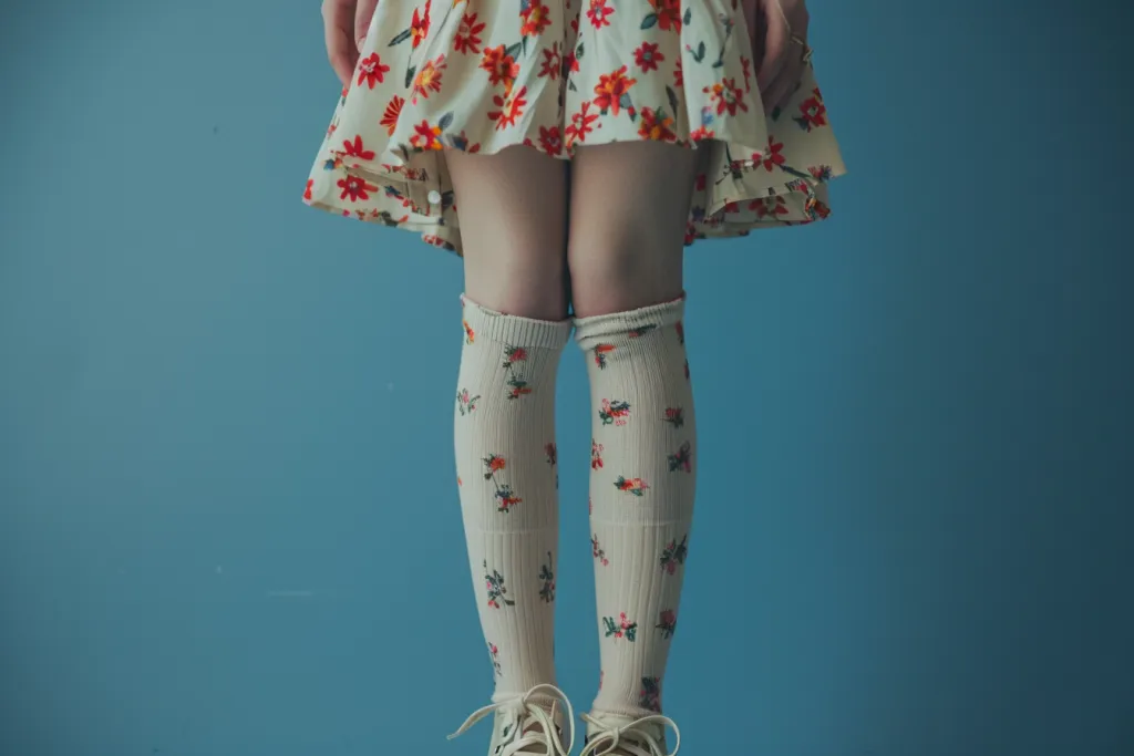 photo of a tall skinny girl wearing a floral dress