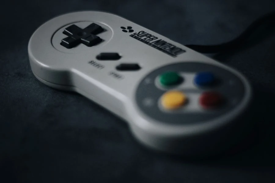 A SNES controller on a black surface