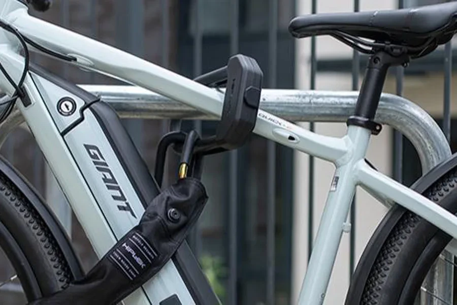 A black lock securing a white e-bike