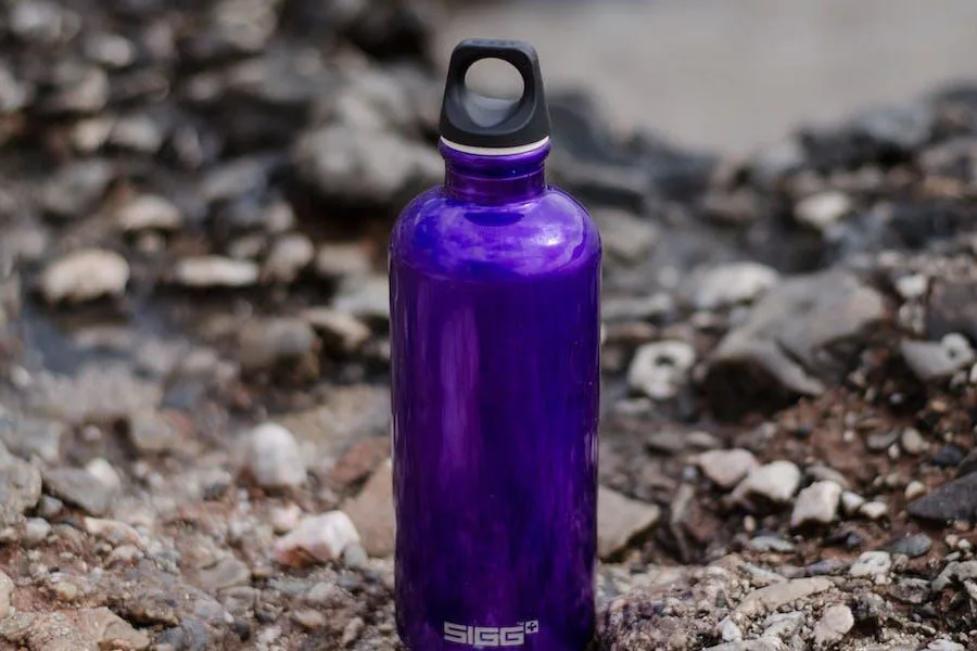 A blue stainless steel reusable water bottle