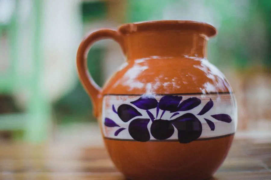 A brown, floral rustic jug
