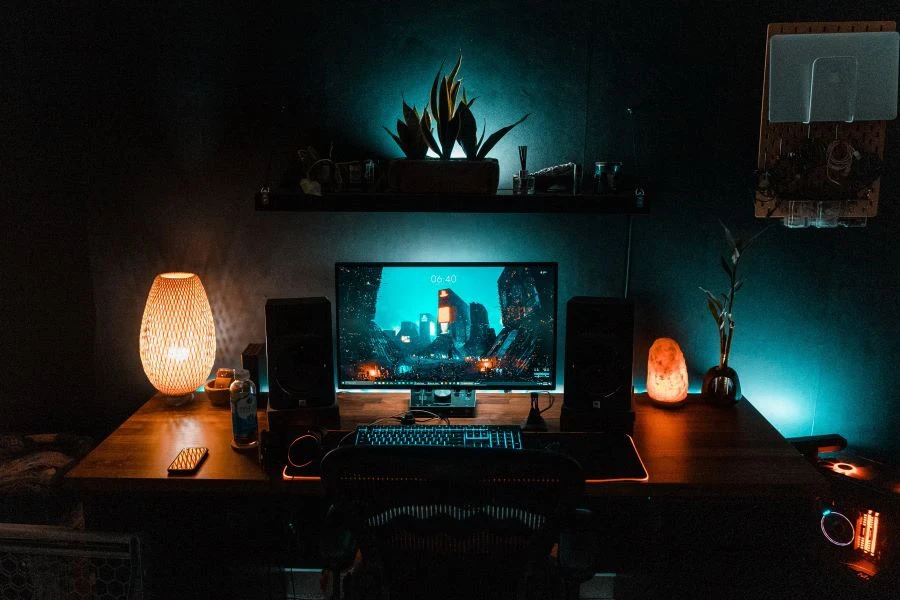 A computer and speakers on a table