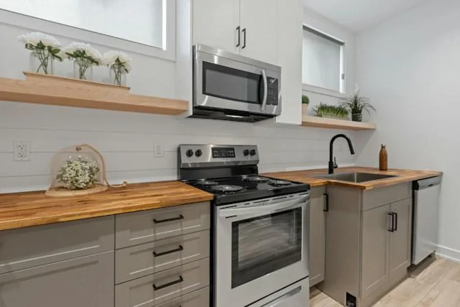 A convection oven placed above a gas cooker