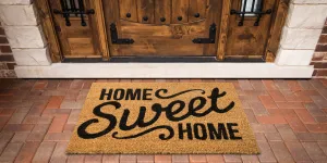 A nicely-designed doormat placed at a front porch