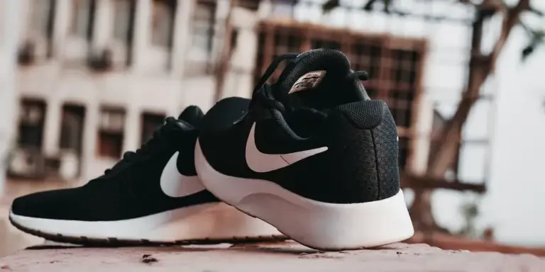 A pair of black and white sports shoes