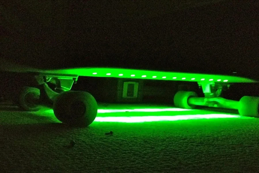 A skateboard with green underglow lights