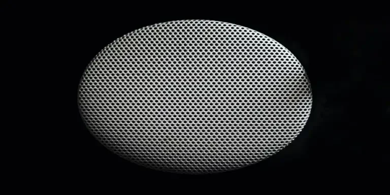A small gray speaker for an immersive audio experience