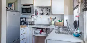 A small kitchen with essential kitchen items