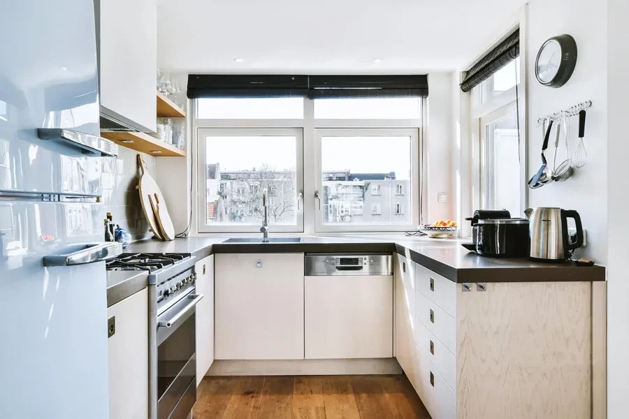 A small kitchen with natural light and open shelves