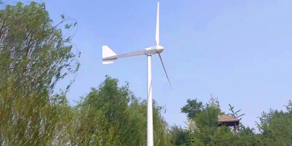 A small wind turbine surrounded by trees