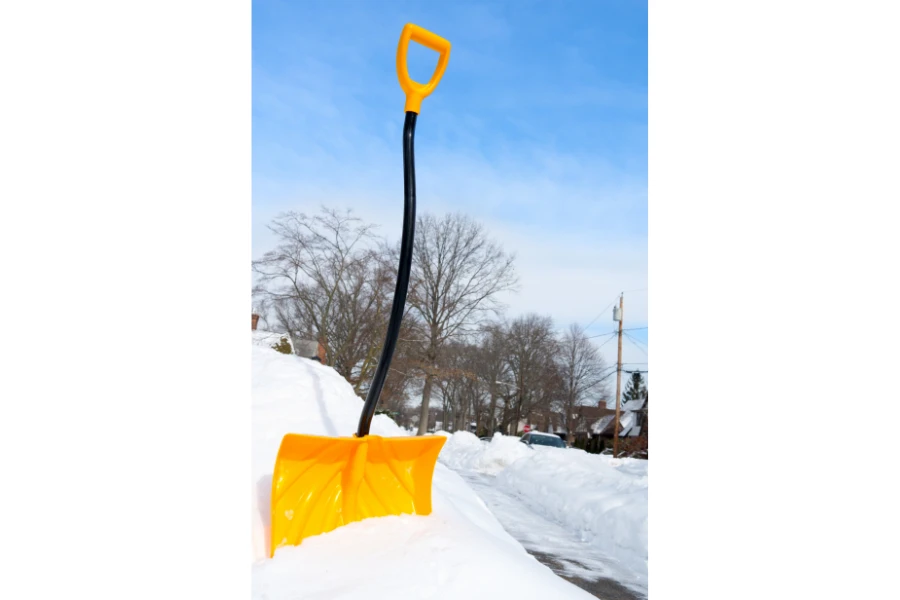 A snow shovel with an ergonomic handle and D-grip