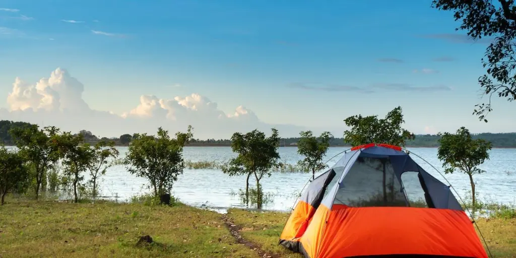 A tent set up near a beautiful natural view
