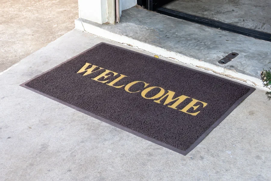 A welcome gray outdoor doormat