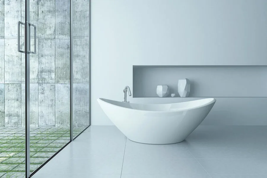 A white double-ended bathtub in a modern bathroom