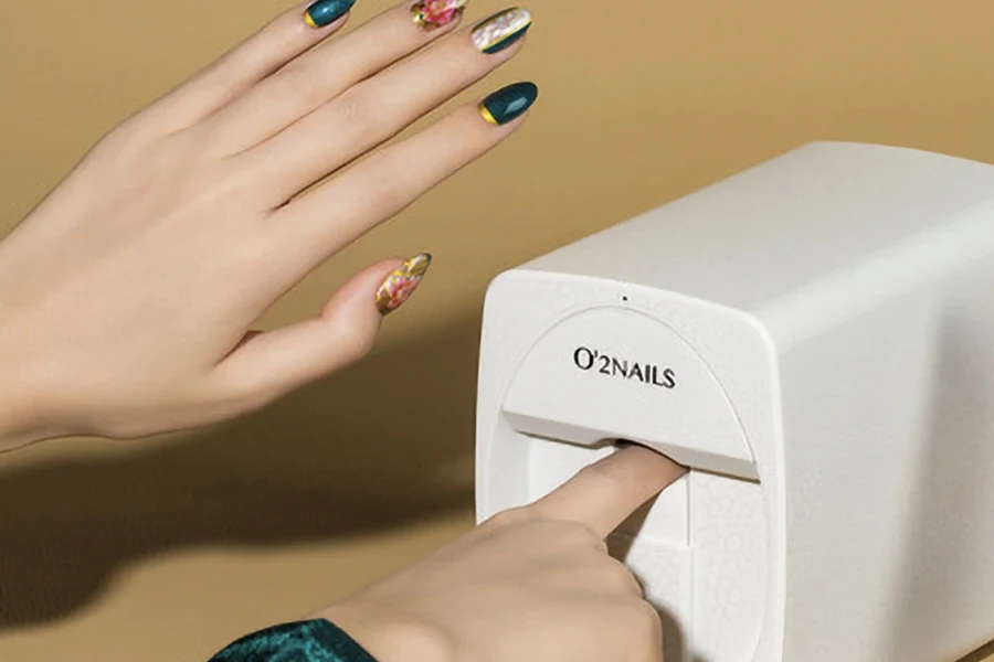 A white nail printer on a light brown background