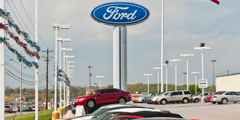 American Flag Flies Over Ford Mustangs