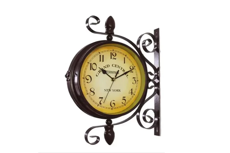 An antique round clock with two faces on an iron mounting