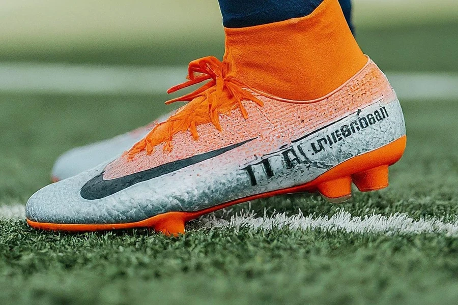 An orange molded cleat on a field