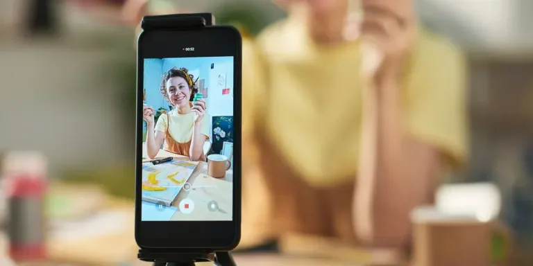 Artist using smartphone to show painting essentials