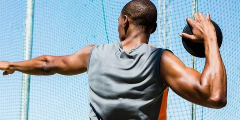 Athlete preparing to throw a discus disc
