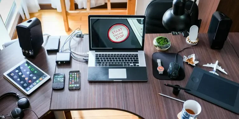 Black and White Laptop Computer on Brown Wooden Desk