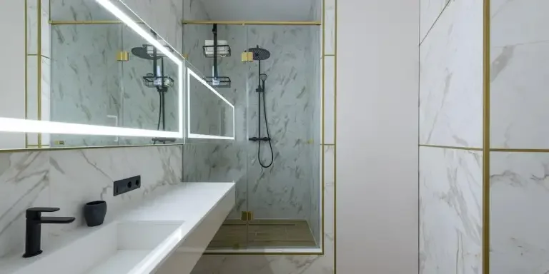 Black metal shower caddy in a bathroom