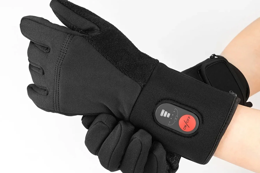 Black rechargeable heated gloves with button on wrist