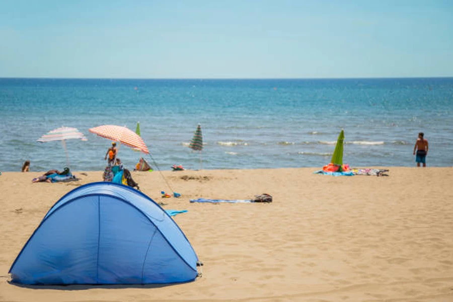 Blue instant pop-up beach tent set up on beach